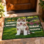 The doormat laid on a stone step at a wooden front door